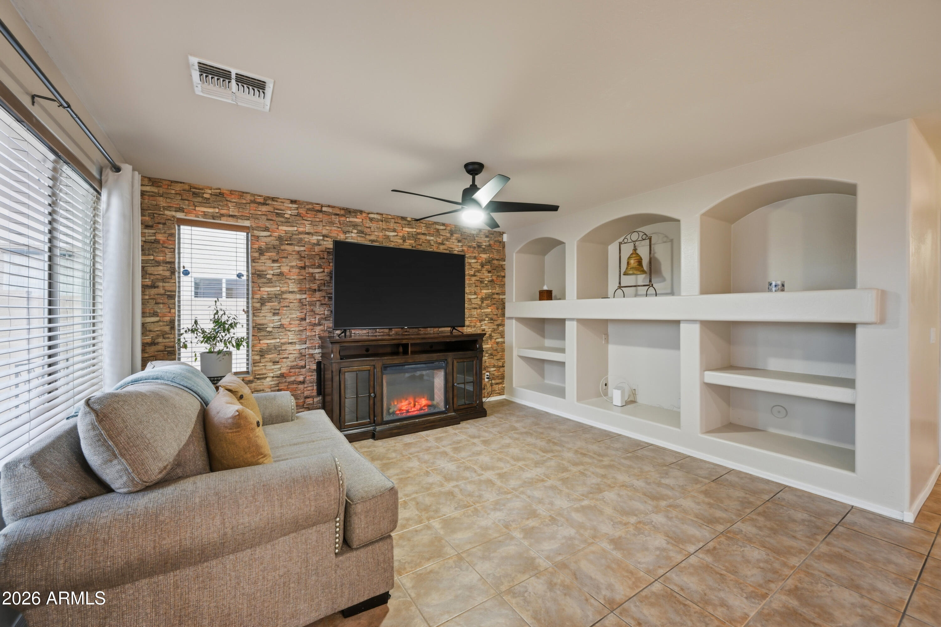 4372 West Alta Vista Road Laveen, AZ 85339 - Photo 43 of 47 a living room with furniture and a flat screen tv