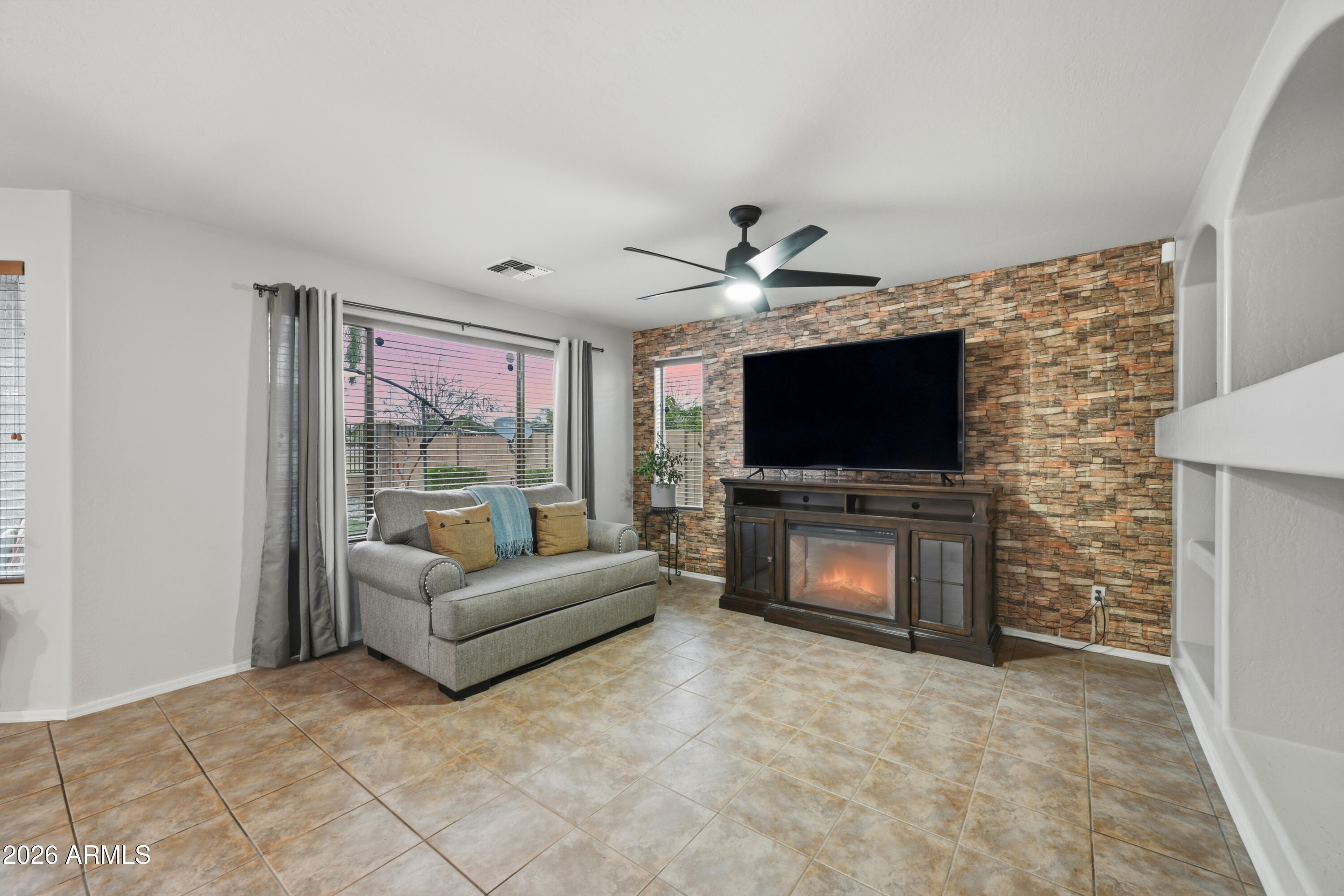 4372 West Alta Vista Road Laveen, AZ 85339 - Photo 44 of 47 a living room with furniture and a flat screen tv
