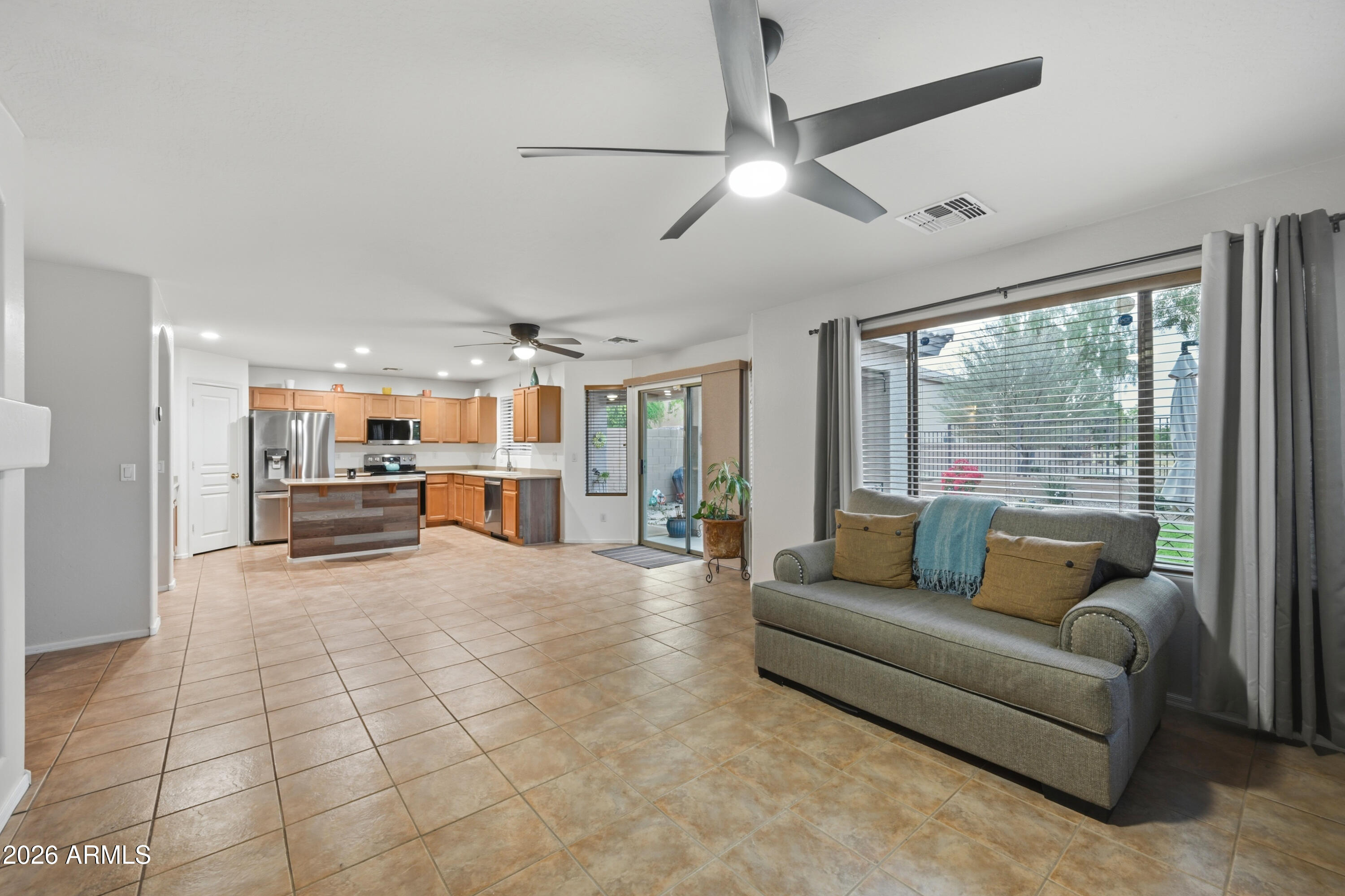 4372 West Alta Vista Road Laveen, AZ 85339 - Photo 45 of 47 a living room with furniture and a flat screen tv