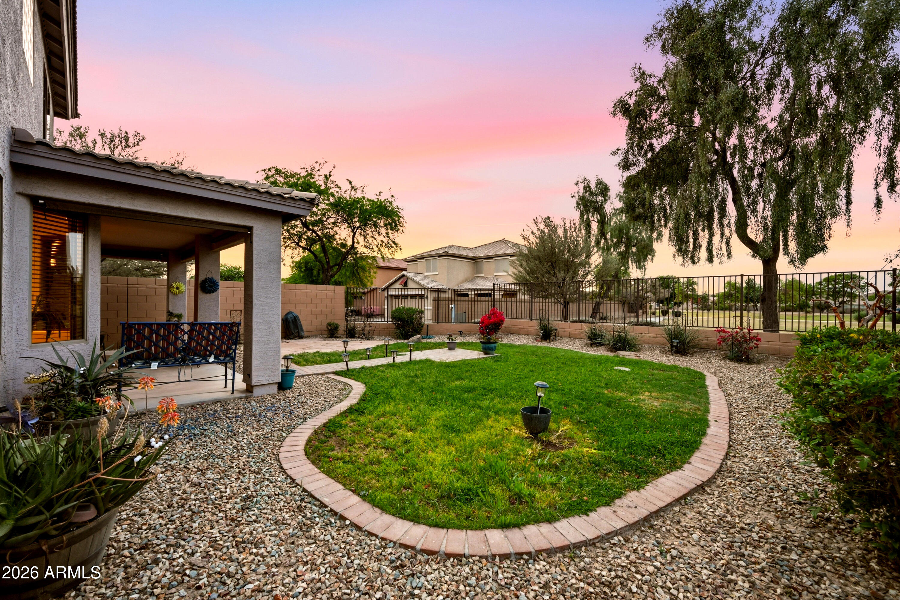 4372 West Alta Vista Road Laveen, AZ 85339 - Photo 5 of 47 a view of a house with garden and sitting area
