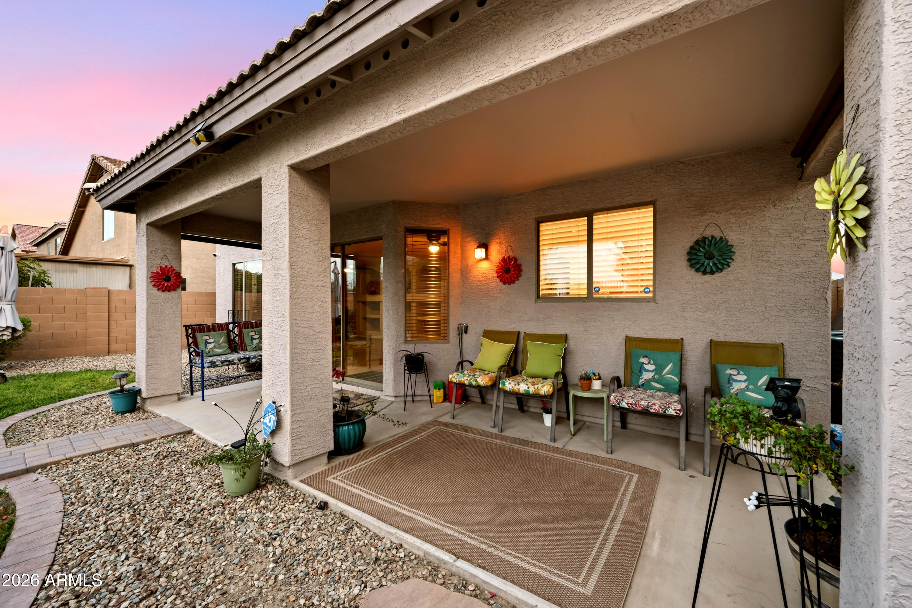 4372 West Alta Vista Road Laveen, AZ 85339 - Photo 6 of 47 a view of a patio with table and chairs potted plants and a table and chair