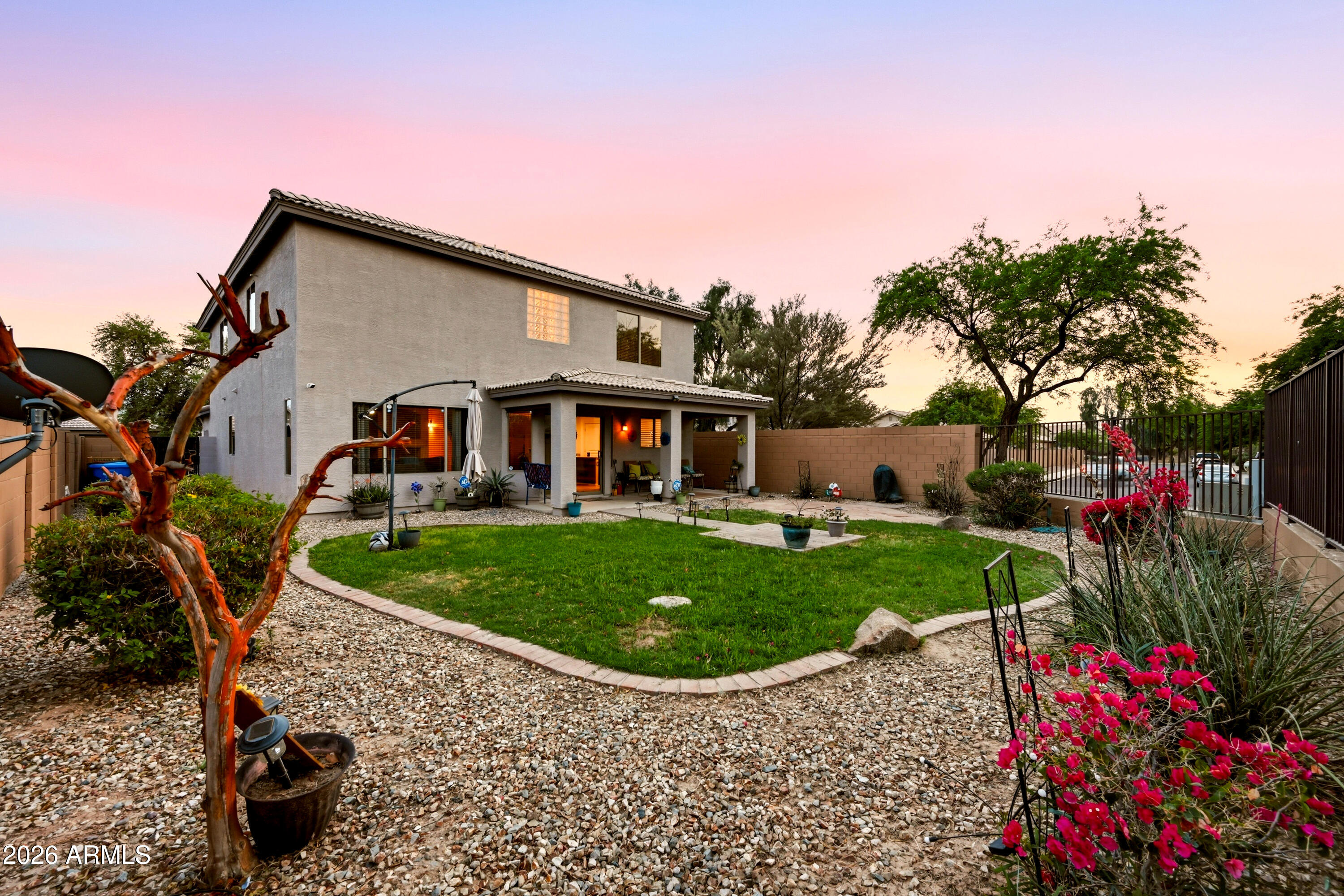 4372 West Alta Vista Road Laveen, AZ 85339 - Photo 8 of 47 a front view of a house with garden