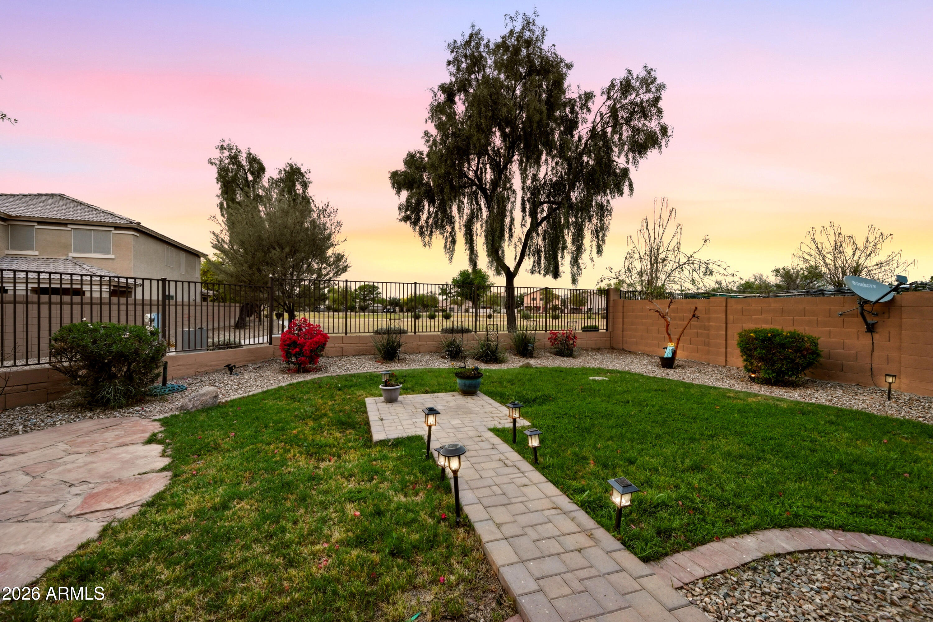 4372 West Alta Vista Road Laveen, AZ 85339 - Photo 9 of 47 a view of a garden with a house