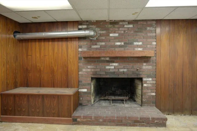 a fireplace with a chair