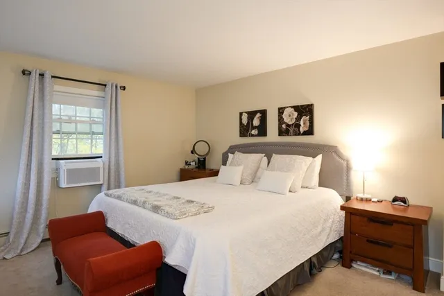 a bedroom with bed and a couch