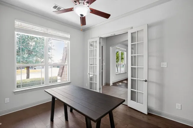 a view of a livingroom with furniture window and wooden floor