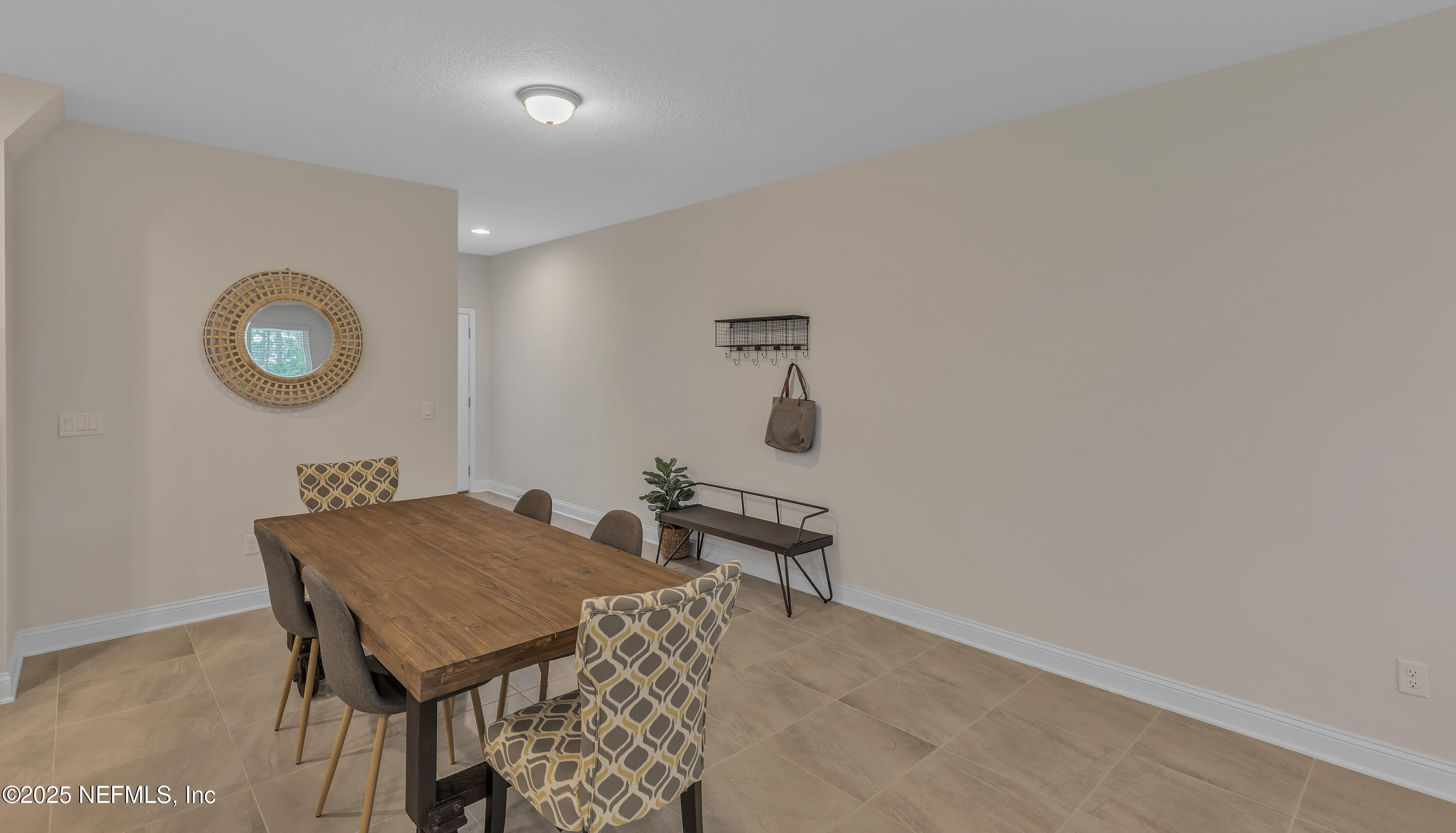 381 Woods Lane St. Augustine, FL 32092 - Photo 14 of 16 a room with a table and chairs