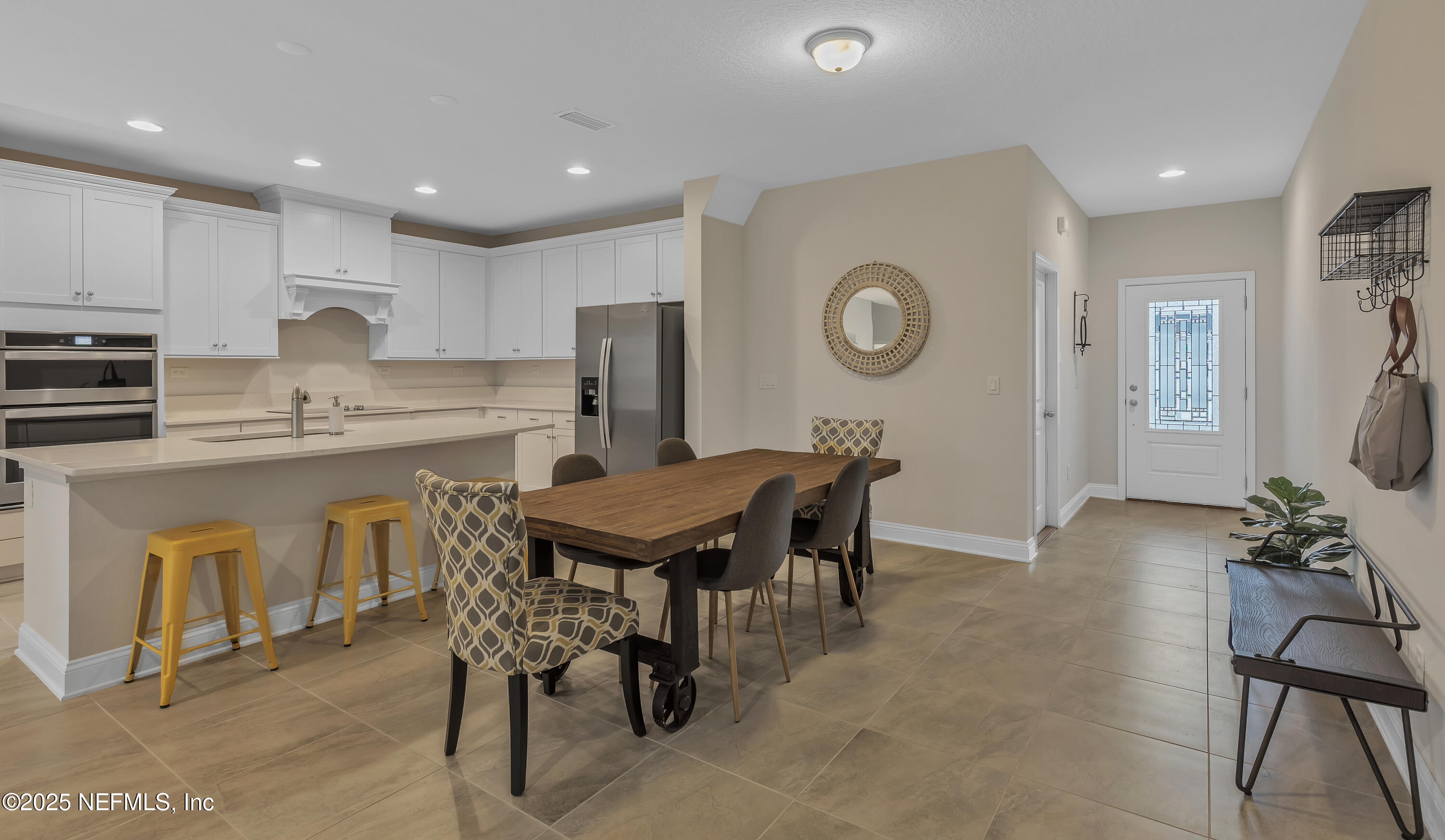 381 Woods Lane St. Augustine, FL 32092 - Photo 6 of 16 a view of kitchen with cabinets table and chairs