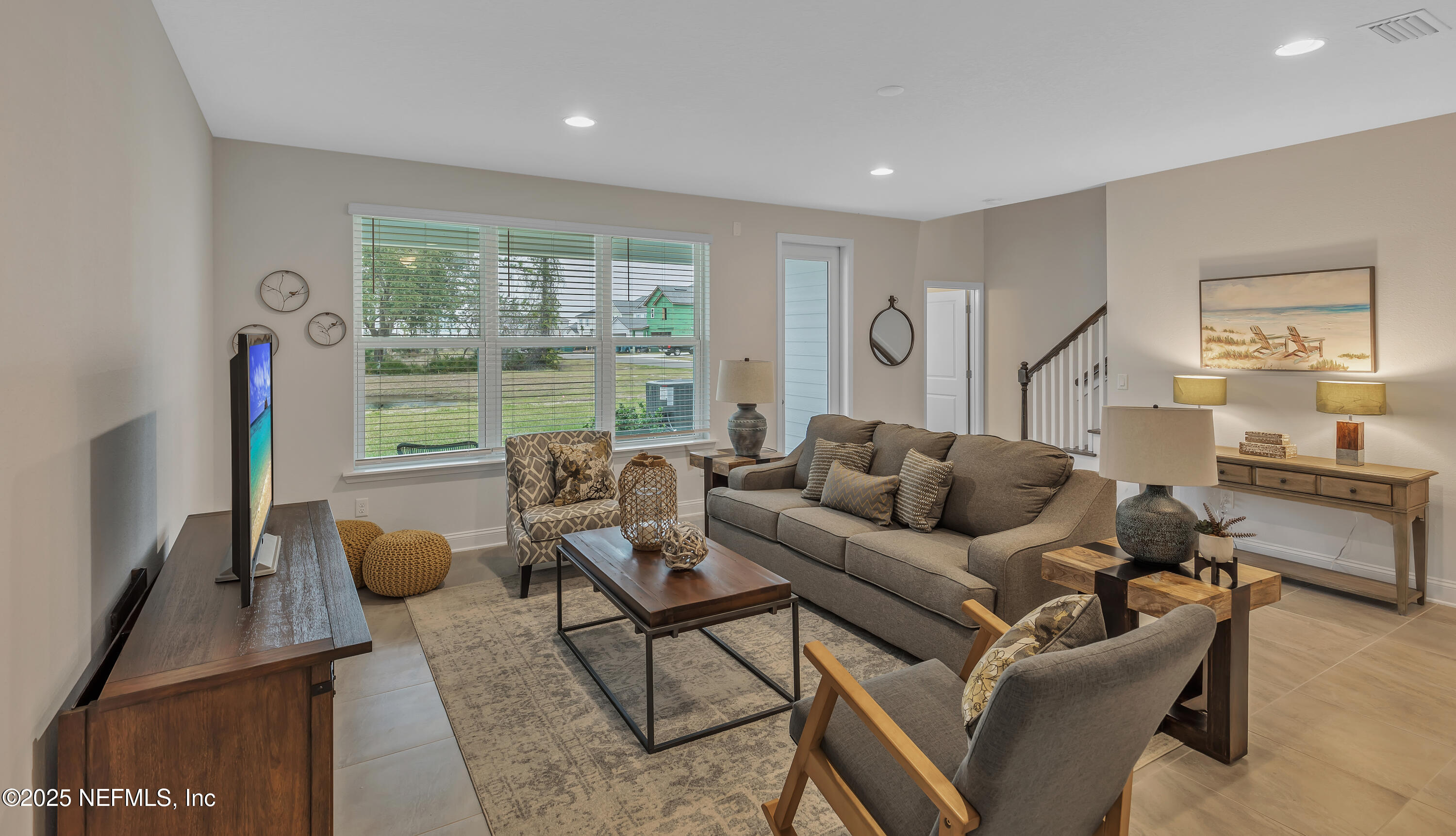 381 Woods Lane St. Augustine, FL 32092 - Photo 8 of 16 a living room with furniture and a large window