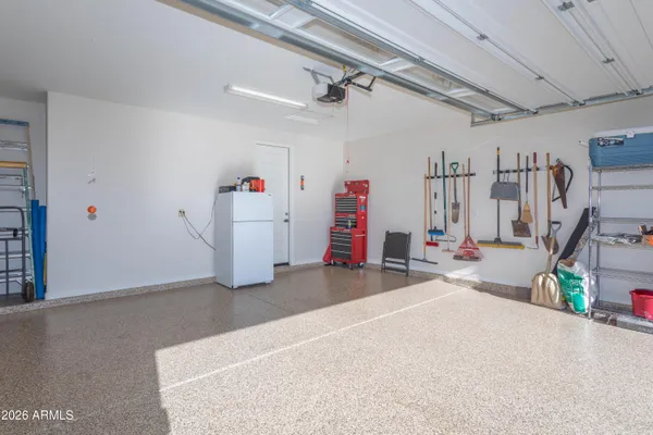 a view of a garage with furniture and a garage