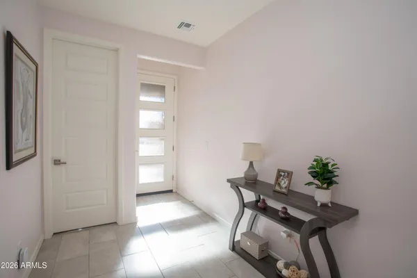 a view of a workspace with furniture and wooden floor