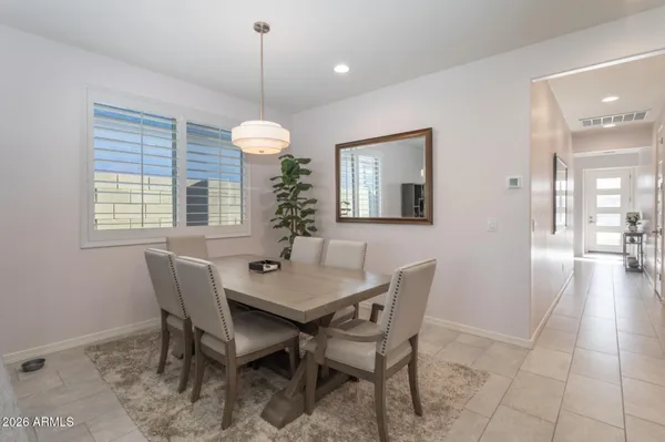a dining room with furniture and window