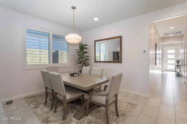 a bathroom with a toilet a sink and a large mirror