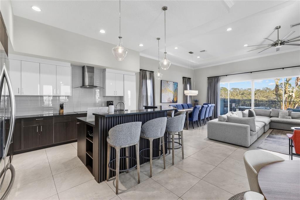 7580 Excitement Drive Reunion, FL 34747 - Photo 12 of 47 a large kitchen with a table and chairs