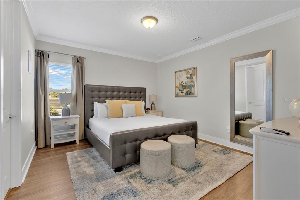 7580 Excitement Drive Reunion, FL 34747 - Photo 13 of 47 a bedroom with a bed and window