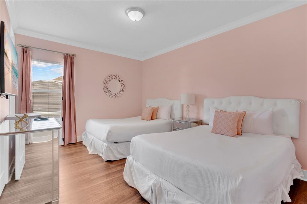 7580 Excitement Drive Reunion, FL 34747 - Photo 20 of 47 a bedroom with two beds and a large window