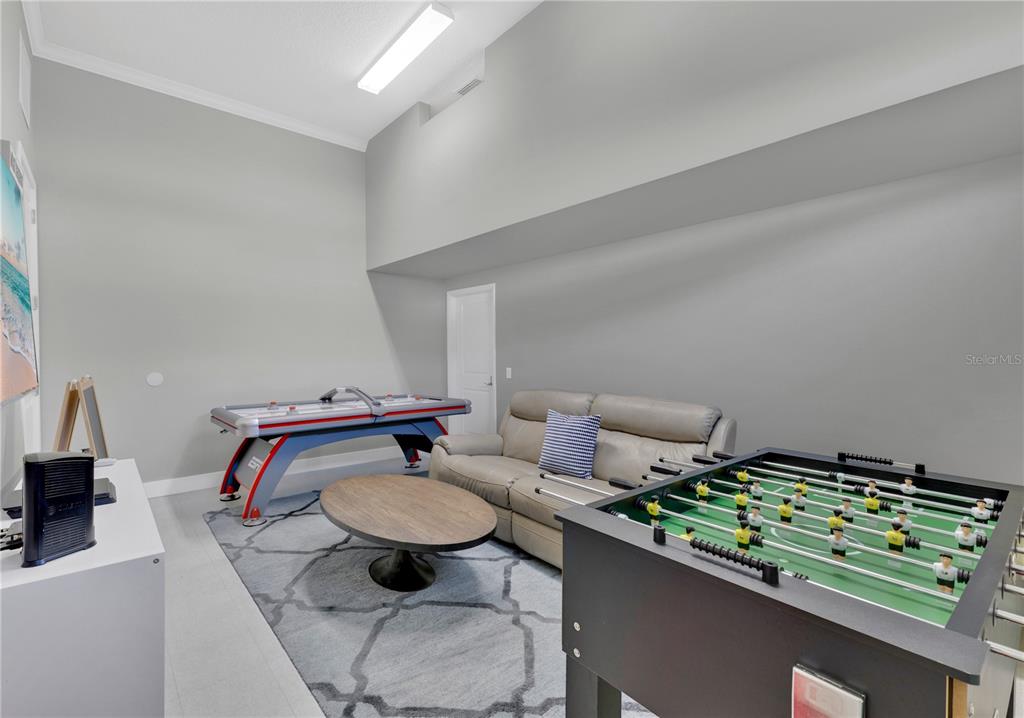 7580 Excitement Drive Reunion, FL 34747 - Photo 31 of 47 a living room with furniture and a rug