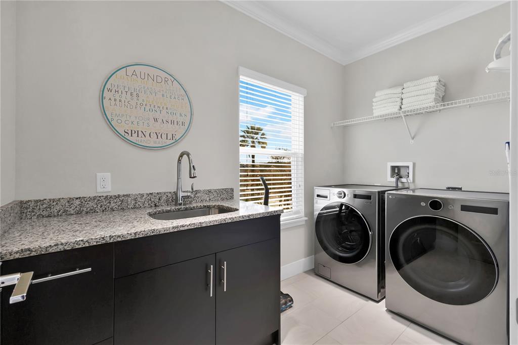 7580 Excitement Drive Reunion, FL 34747 - Photo 32 of 47 a view of a kitchen with washer and dryer