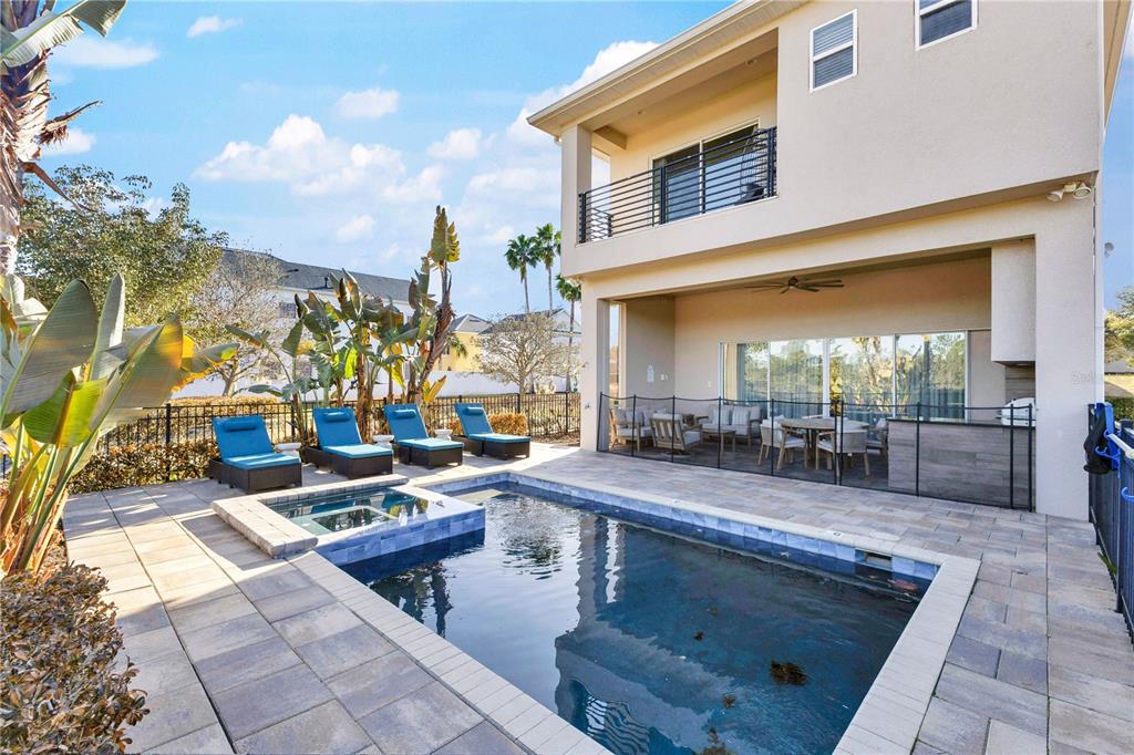 7580 Excitement Drive Reunion, FL 34747 - Photo 37 of 47 a view of a patio with dining table and chairs with wooden floor