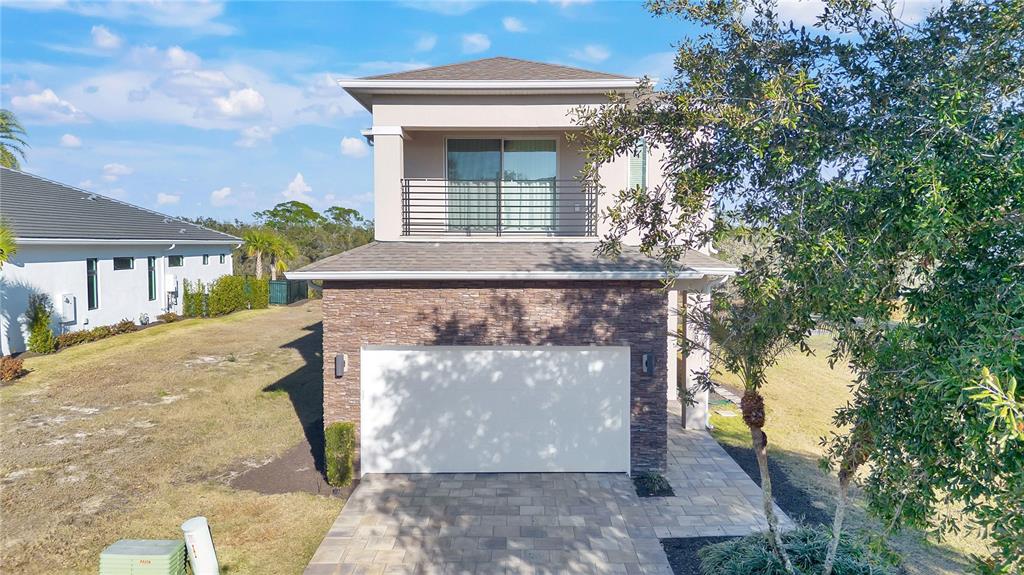 7580 Excitement Drive Reunion, FL 34747 - Photo 38 of 47 a view of a small house with tree s