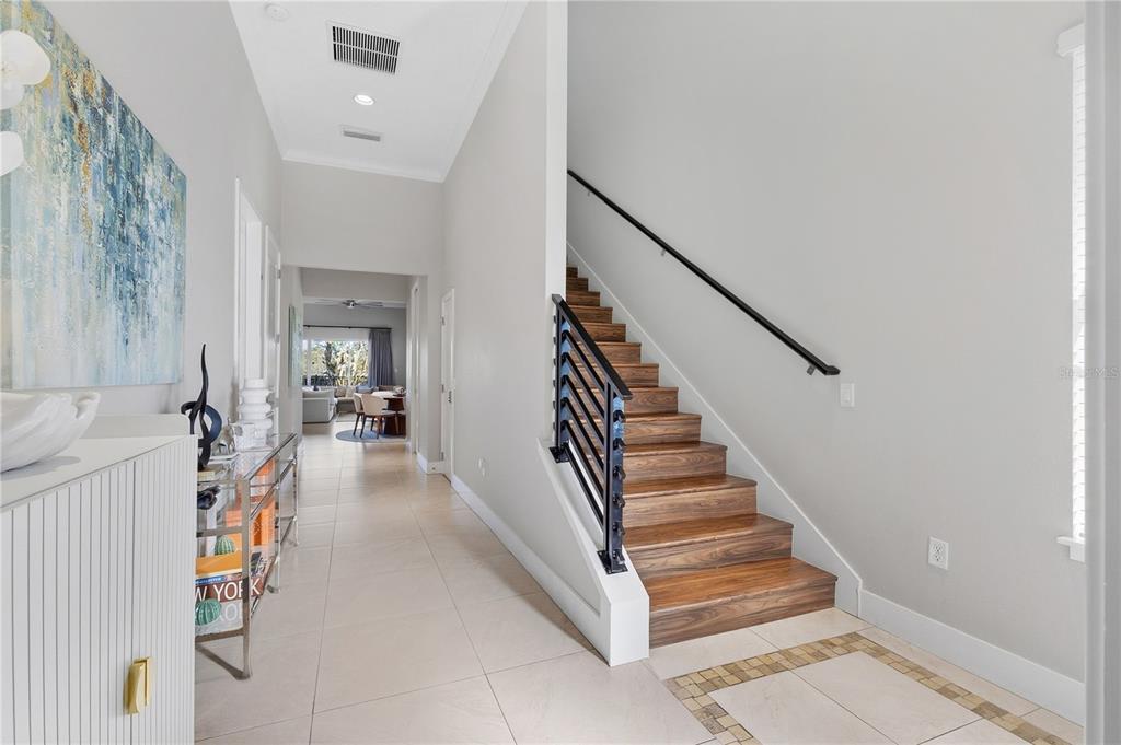 7580 Excitement Drive Reunion, FL 34747 - Photo 4 of 47 a view of entryway and hall with wooden floor