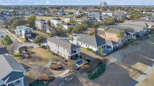 an aerial view of a house with a lake view
