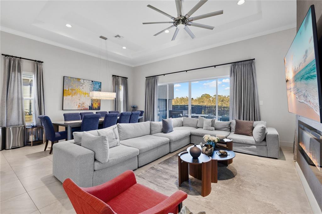 7580 Excitement Drive Reunion, FL 34747 - Photo 6 of 47 a living room with furniture and a large window