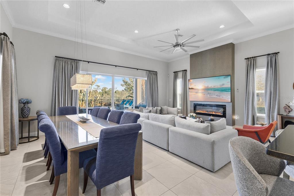 7580 Excitement Drive Reunion, FL 34747 - Photo 8 of 47 a living room with furniture a large window and a flat screen tv