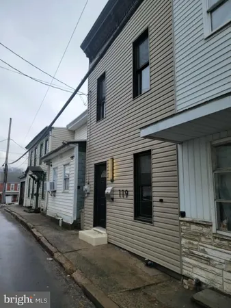 a view of a house with a street