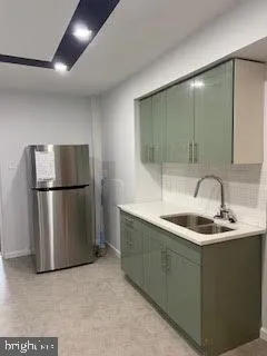 a view of a room that has a couch and a table in it