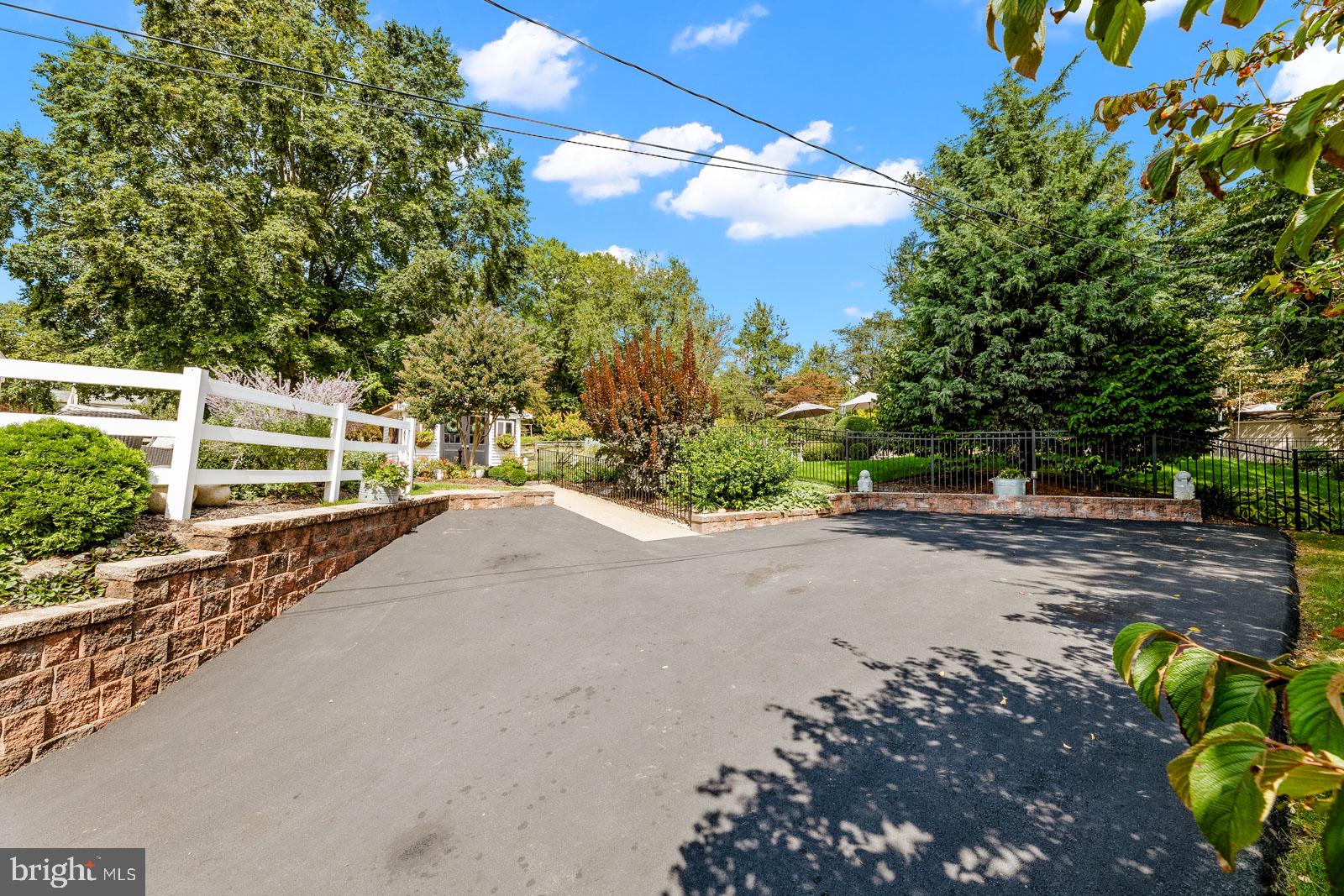 517 Georgian Road Glenside, PA 19038 - Photo 76 of 80 Charming driveway with lush greenery.