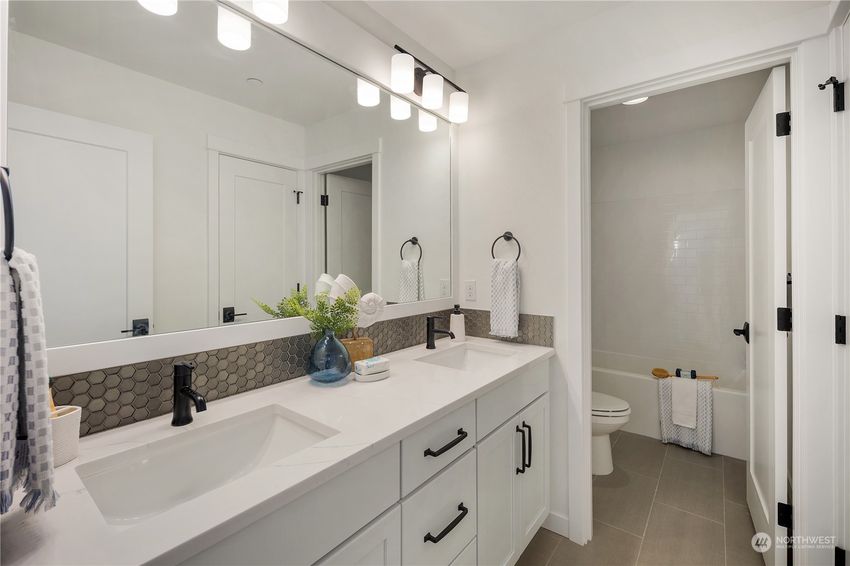 3920 211th Place Southeast Bothell, WA 98021 - Photo 23 of 26 a bathroom with a double vanity sink and mirror