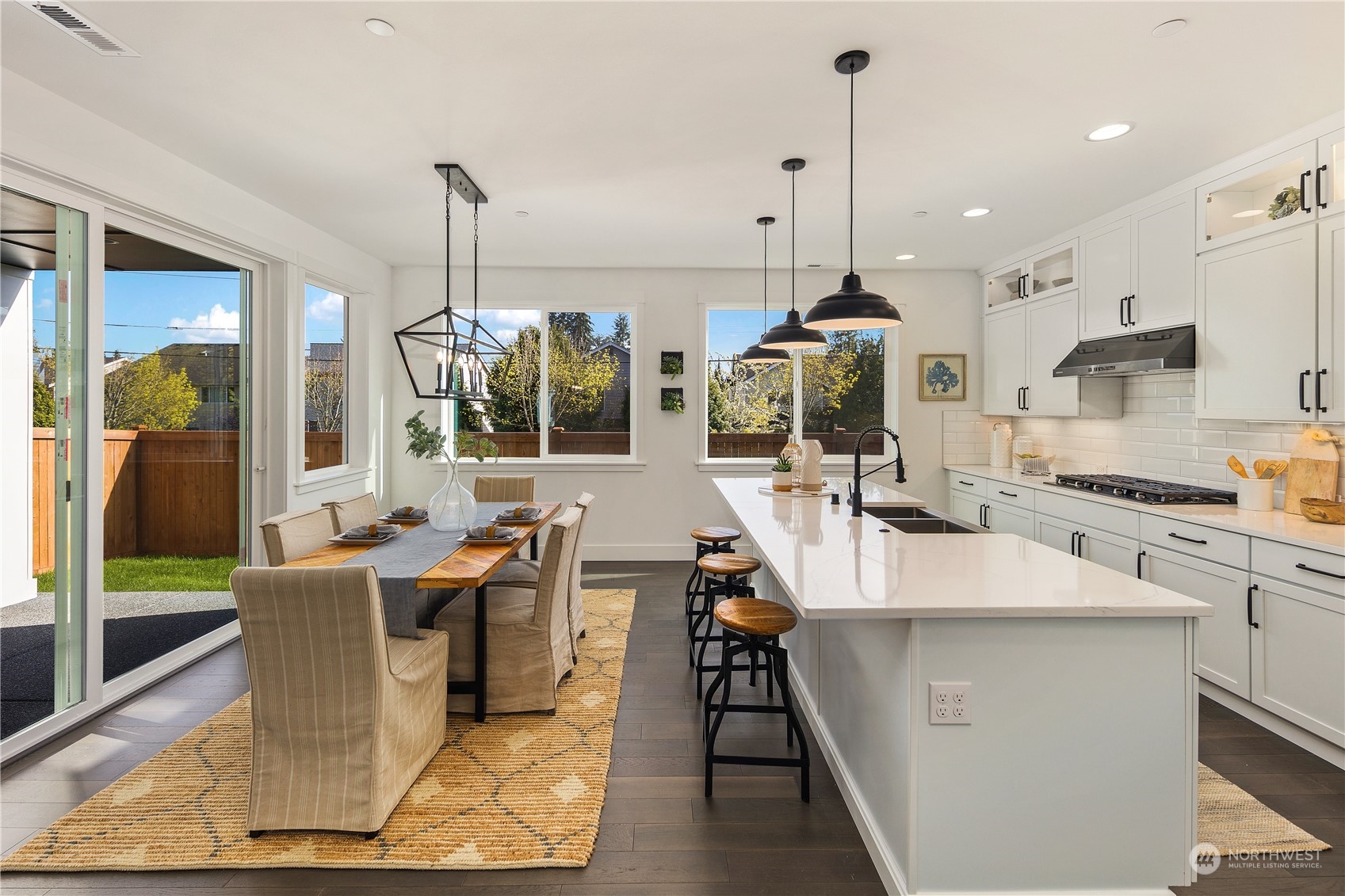 3920 211th Place Southeast Bothell, WA 98021 - Photo 4 of 26 a dining table chairs and a chandelier
