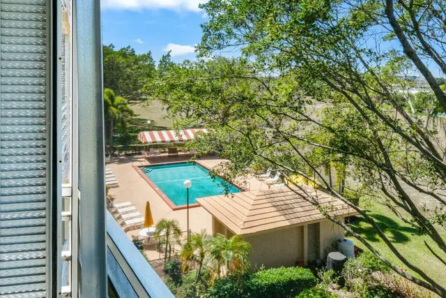 a view of balcony and yard