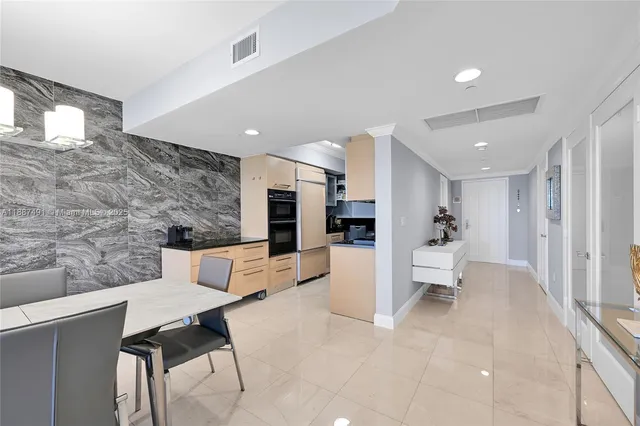 a living room with fireplace furniture and a table