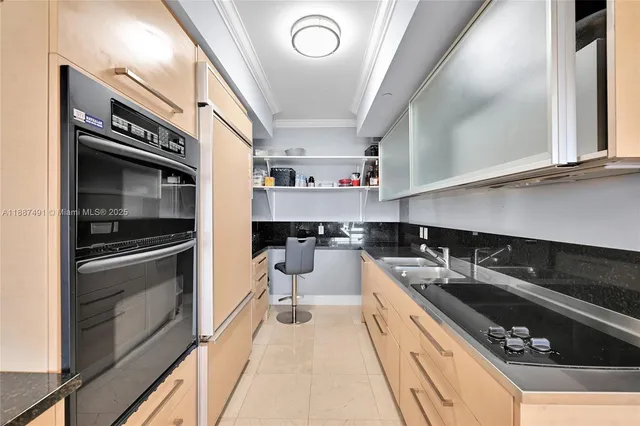 a kitchen with a sink stove and microwave