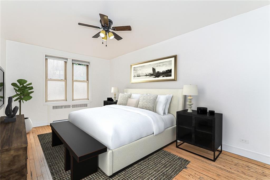 9437 Shore Road, Unit B9 Brooklyn, NY 11209 - Photo 11 of 22 a bedroom with a bed and wooden floor