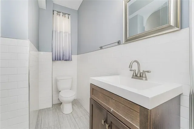 a view of bathroom with a sink and a toilet