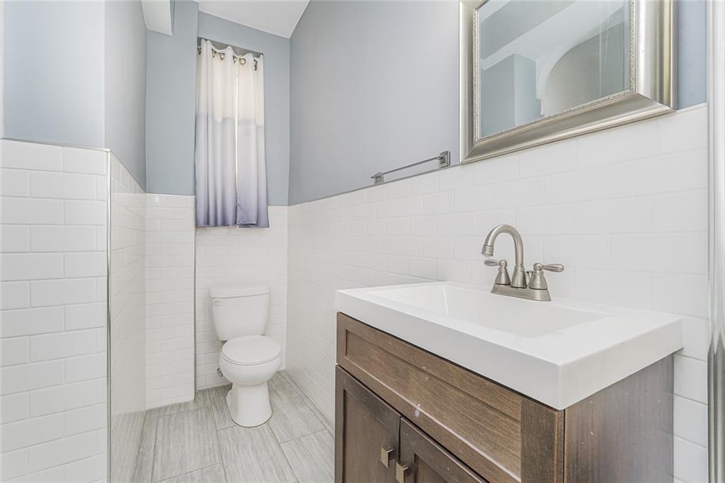 9437 Shore Road, Unit B9 Brooklyn, NY 11209 - Photo 13 of 22 a view of bathroom with a sink and a toilet