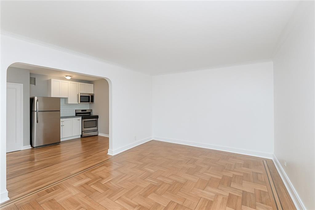 9437 Shore Road, Unit B9 Brooklyn, NY 11209 - Photo 17 of 22 a view of an empty room and kitchen view