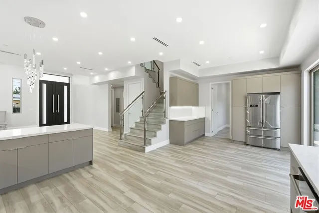 a bathroom with a double vanity sink toilet mirror and shower