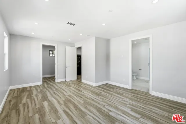 a view of entryway with wooden floor