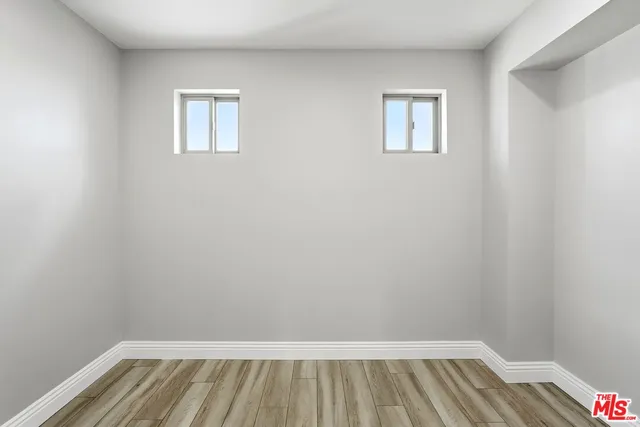 a view of an empty room with glass door