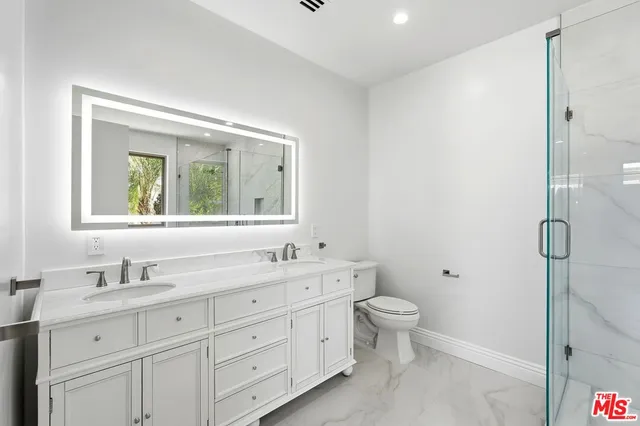 a view of an empty room with a cabinet