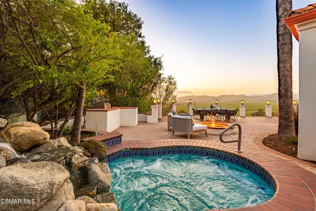 a view of a swimming pool with a lounge chairs