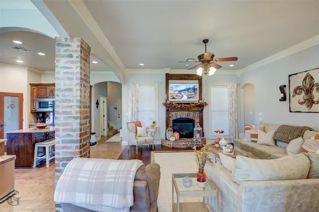 a living room with furniture and a fireplace