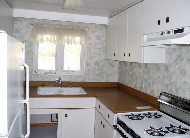 3645 Flossmoor Road Homewood, IL 60422 - Photo 2 of 10 a kitchen with a sink stove and cabinets