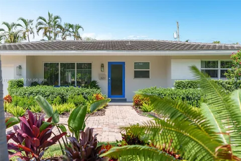 front view of a house with a garden