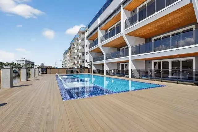 a front view of a building with a lot of windows