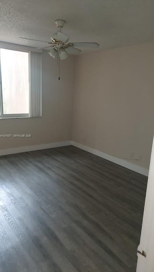 4055 West McNab Road, Unit H204 Pompano Beach, FL 33069 - Photo 5 of 6 wooden floor in an empty room